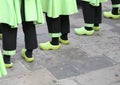 people with green clogs and black trousers Royalty Free Stock Photo