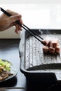 People grilling korean barbeque