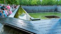 People at Ground Zero Memorial Manhattan for September 11 Terrorist Attack with Engraved Names of Victims. Patriot Day - New York