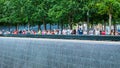 People at Ground Zero Memorial Manhattan for September 11 Terrorist Attack with Engraved Names of Victims. Patriot Day - New York