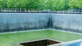 People at Ground Zero Memorial Manhattan for September 11 Terrorist Attack with Engraved Names of Victims. Patriot Day - New York