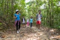 People Group With Backpacks Trekking On Forest Path, Young Men And Woman On Hike Royalty Free Stock Photo