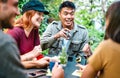 People group drinking latte at coffee bar garden - Happy friends talking and having fun together at hostel dehors - Life style Royalty Free Stock Photo