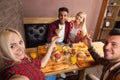 People Group Eating Fast Food Burgers Potato Sitting At Wooden Table In Cafe Taking Selfie Photo Royalty Free Stock Photo