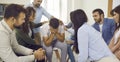 People comforting and supporting man who's crying during their group therapy session Royalty Free Stock Photo