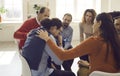 Participant giving support during therapy group meeting or training session Royalty Free Stock Photo