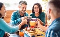 People group toasting latte at coffee bar rooftop - Friends talking and having fun together at cappuccino restaurant - Life style