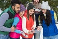 People Group Using Smart Phone Snow Forest Happy Smiling Young Friends Walking Outdoor Winter