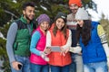 People Group Using Smart Phone Snow Forest Happy Smiling Young Friends Walking Outdoor Winter