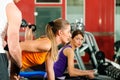 People in gym exercising with weights Royalty Free Stock Photo