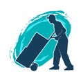 Silhouette of a male worker pushing lori wheels transporting carboard boxes. Royalty Free Stock Photo