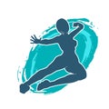 Silhouette of a woman doing a martial art kick. Royalty Free Stock Photo