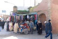 People with hand cart at market stall
