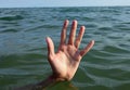 people hand while drowning and asking for help symbol of depression