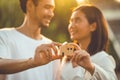 people hand holding miniature wooden house model for banking housing mortgage real estate rent lease home family concept Royalty Free Stock Photo