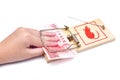 Hand and mousetrap with money Royalty Free Stock Photo