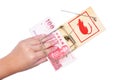 Hand and mousetrap with money Royalty Free Stock Photo