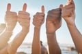 People, hands and diversity with thumbs up at beach for good job, agreement or success together. Hand of group showing Royalty Free Stock Photo