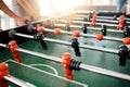 People hands, foosball table and competition in arcade with retro games, soccer action board and plastic toys for team
