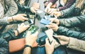 People hands having addicted fun together using smartphone - Millenial sharing content on social media network with mobile smart Royalty Free Stock Photo