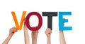 People Hands Holding Colorful Straight Word Vote