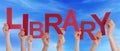 People Hands Holding Red Word Library Blue Sky Royalty Free Stock Photo