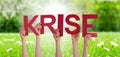 People Hands Holding Word Krise Means Crisis, Grass Meadow Royalty Free Stock Photo