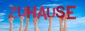 People Hands Holding Word Zuhause Means Home, Blue Sky Royalty Free Stock Photo