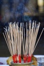 People hands lighting incense stick fire,Pay respect to buddha statue Royalty Free Stock Photo