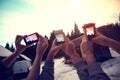 People hands taking pictures of burning sunset sky Royalty Free Stock Photo