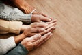 People, hands together and generations in care above on mockup for unity, compassion or trust on wooden table. Group