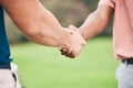 People, handshake and sport for partnership, trust or unity in community, collaboration or teamwork on grass field. Team Royalty Free Stock Photo