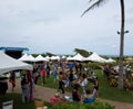 People hang out and check out booths at Wanderlust yoga event