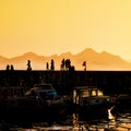 people at harbor during sunset Royalty Free Stock Photo