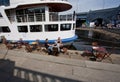 People have breakfast in outdoor cafe at river bank Royalty Free Stock Photo