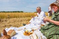 People have breakfast, traditional meal in open at the harvest time Royalty Free Stock Photo
