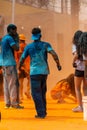 People have fun with paint powder during a colorful race at Dique do Tororo in the city of Salvador, Bahia