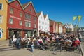 People have lunch at street restaurants at Bruggen in Bergen, Norway. Royalty Free Stock Photo