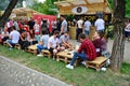 People have a snack at the Street Food Festival in central park Cluj. Royalty Free Stock Photo