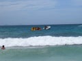 People having fun on banana boat in Cape Arraial Royalty Free Stock Photo