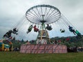 People having fun in a chains carousel