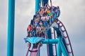 People having fun Mako Rollercoaster on lightblue cloudy sky bakcground at Seaworld 8