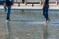 People having fun in a mirror fountain in Bordeaux, France Royalty Free Stock Photo