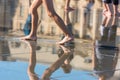 People having fun in a mirror fountain in Bordeaux, France Royalty Free Stock Photo