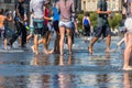 People having fun in a mirror fountain in Bordeaux, France Royalty Free Stock Photo