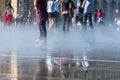 People having fun in a mirror fountain in Bordeaux, France Royalty Free Stock Photo