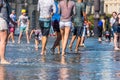 People having fun in a mirror fountain in Bordeaux, France Royalty Free Stock Photo