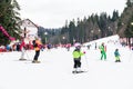 People Having Fun Skiing On Snowy Mountain