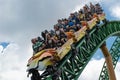 People having fun terrific Cheetah Hunt rollercoaster on lightblue cloudy sky background 61 Royalty Free Stock Photo
