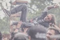 Metalhead  during a crowdsurfing at a metal concert Royalty Free Stock Photo